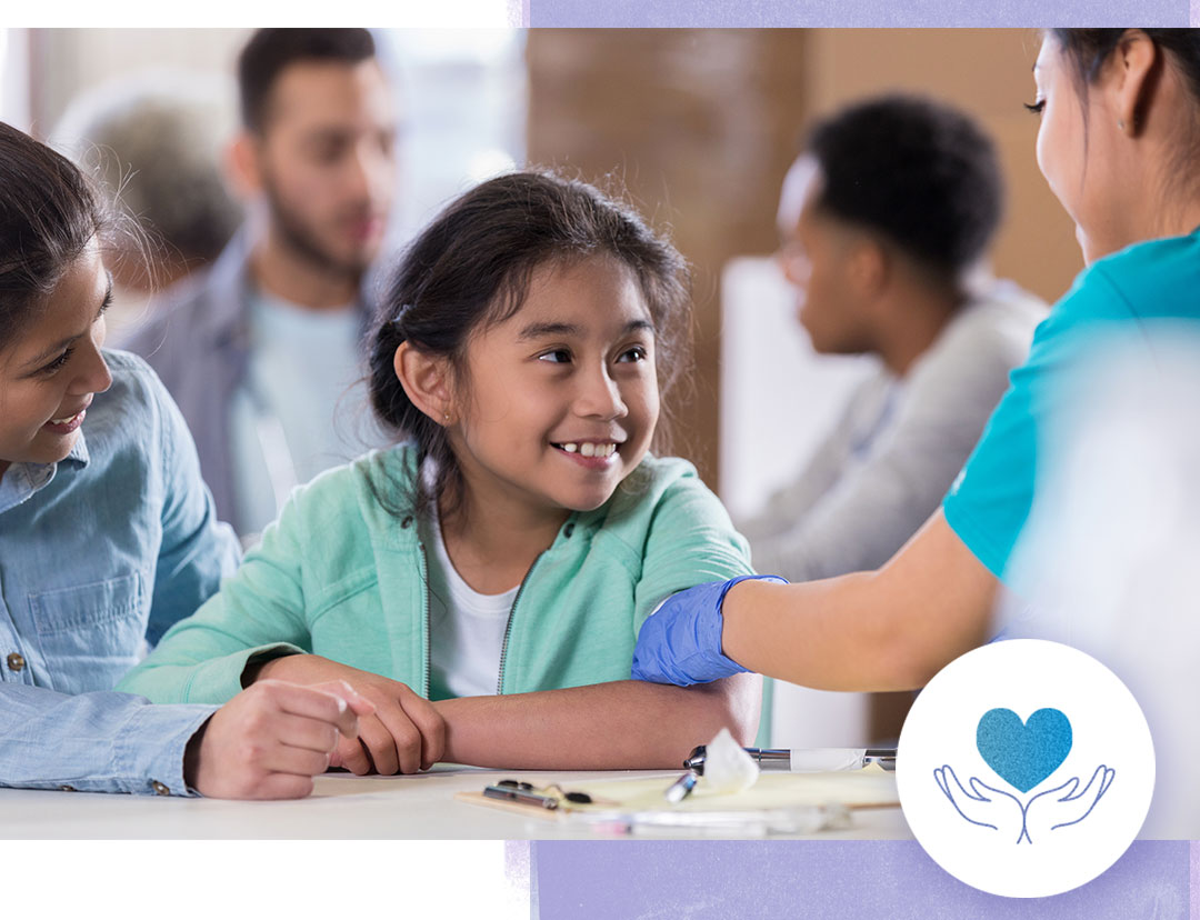 Young hispanic girl with her mother at a flu clinic