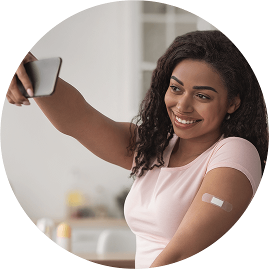 Young woman taking selfie after a vaccine
